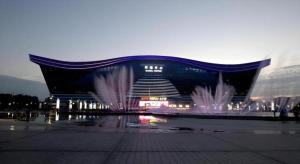 a large building with a fountain in front of it at 7Days Premium Chengdu New Century Global Centre New Exhibiton Branch in Chengdu