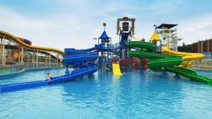 a water park with a bunch of water slides at Yitel Collection Nanjing Zhongshan Dong Road Ming Palace Metro Station in Nanjing