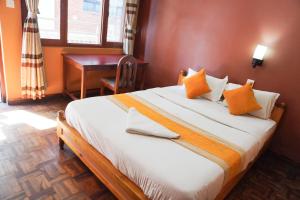 Postel nebo postele na pokoji v ubytování Khangsar Home