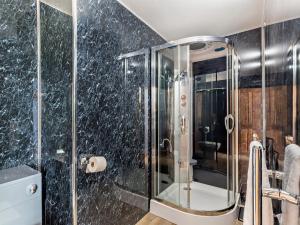 a shower with a glass door in a bathroom at 8 Bed in Pateley Bridge 95111 in Sawley +27 photos