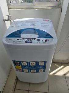 a electronic toilet in a bathroom with a window at Beachfront City Escape Sunset Balcony AC WiFi in Colombo