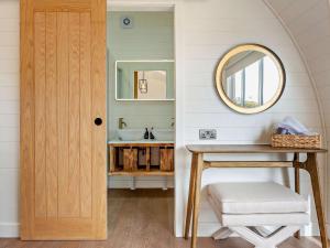 a bathroom with a sink and a mirror at 1 Bed in Nigg 96065 in Nigg +27 photos