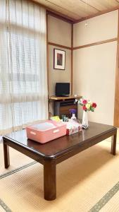 a table with two boxes on top of it at 苗場ウッドインだいまる in Yuzawa