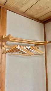 a group of wooden sticks hanging from a ceiling at 苗場ウッドインだいまる in Yuzawa