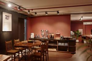 a dining room with a table and chairs at Asian Ruby Hotel & Spa - 122F Bui Thi Xuân Street in Ho Chi Minh City
