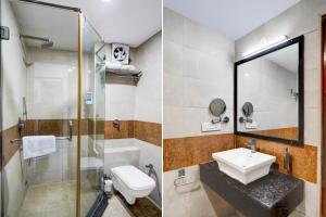 デヘラードゥーンにあるSuper Townhouse Oak ONGC Crossway Formerly Hotel Gold Stone Comfortの洗面台、トイレ、シャワー付きのバスルーム