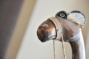 a close up of a wooden horse figurine at Hotel Sandmanns am Dom in Cologne
