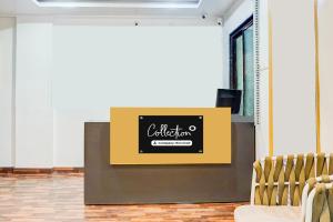 a sign on a podium in a room with chairs at Super Collection O Manjari - Mundhwa Road Formerly 7 Treats in Mundhwa