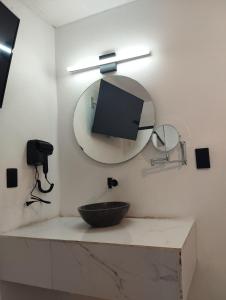 a bathroom with a sink and a mirror at Palacio de los Angeles in San Felipe Hueyotlipan +11 photos