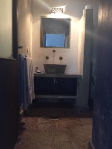 a bathroom with a sink and a mirror at VillaKorculaStepintheBlue in Smokvica