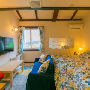 Postel nebo postele na pokoji v ubytování 箱根エレガンス