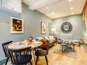 a living room with a table and a couch at 1 Bed in Charmouth 87528 in Charmouth