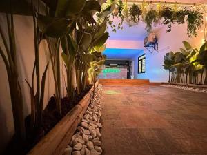 een hal met potplanten in een gebouw bij Entire 2BR Private Villa eith Indoor Pool & BBQ Grill in Sampong
