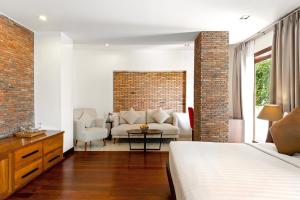 Postel nebo postele na pokoji v ubytování Nita By Vo Luxury Hotel