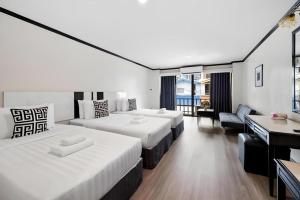 Postel nebo postele na pokoji v ubytování Town In Town Gardent Resort