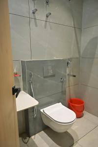 a small bathroom with a toilet and a shower at Shree shyam hotel & restaurant in Mahendragarh