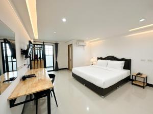 Ένα ή περισσότερα κρεβάτια σε δωμάτιο στο Wises Hotel