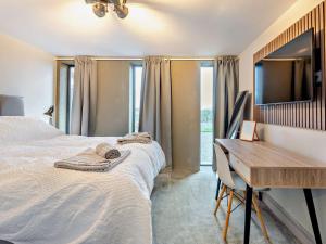 a bedroom with a desk and a bed and a desk and a desk at 3 Bed in Holmfirth 94342 in Thurlstone
