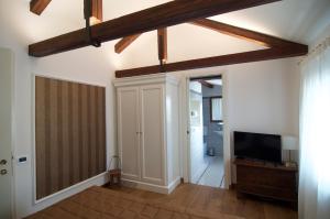 Televiisor ja/või meelelahutuskeskus majutusasutuses Casa Colleoni