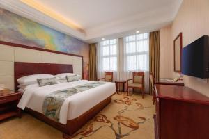 TV a/nebo společenská místnost v ubytování Vienna International Hotel Shanghai Songjiang Branch