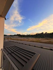 a view of a roof of a building with a road at Kozai Modern Cozy Stay Alpaca Homestay 01 in Bintulu