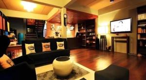 a living room with a couch and a tv at The Royal Chiangkhan Boutique Hotel in Chiang Khan +149 photos
