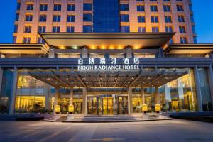 a building with a sign that reads rush radiance hotel at Brigh Radiance Hotel Yantai in Yantai