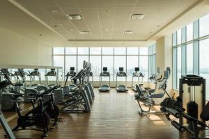 a gym with rows of treadmills and elliptical machines at Hyatt Regency Cartagena in Cartagena de Indias