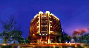 a large building with lights on top of it at Liwan International Hotel Chengdu in Chengdu