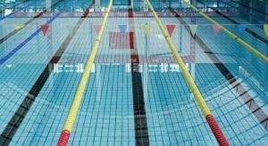 a view of a swimming pool with yellow and blue tiles at Telecom International Hotel in Kunming