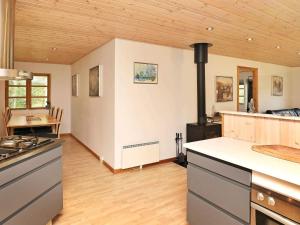 a kitchen with a stove and a counter top at 6 person holiday home in Læsø-By Traum in Læsø