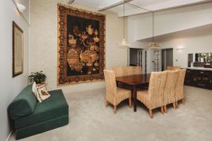 a dining room with a table and chairs at Family Fun - 4BR home with swimming pool and spa in New Plymouth