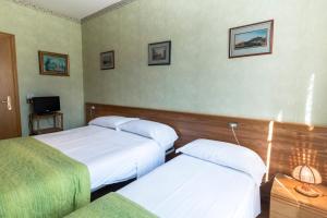 Postel nebo postele na pokoji v ubytování Camere R 75