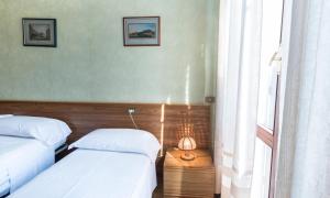 Postel nebo postele na pokoji v ubytování Camere R 75