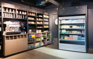 a grocery store aisle with a lot of products at Citiez Hotel Amsterdam in Amsterdam
