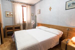 Postel nebo postele na pokoji v ubytování Camere R 75