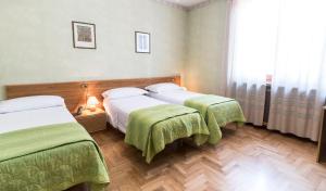 Postel nebo postele na pokoji v ubytování Camere R 75