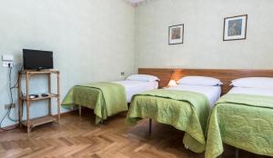 Postel nebo postele na pokoji v ubytování Camere R 75