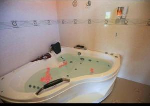 a bath tub in a corner of a bathroom at Ngamta Hotel in Mae Hong Son +67 photos