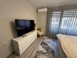 TV a/nebo společenská místnost v ubytování Мия 6 Deluxe