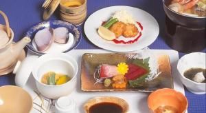 a table with plates of food and bowls of soup at Fujino Kinjo in Shimo-yoshida