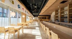 a dining room with tables and chairs in a restaurant at New Biwako Hotel in Zeze-Awazumachi