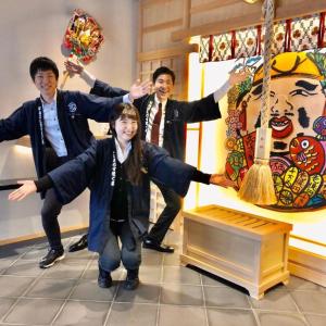 a group of people standing in front of a painting at NAMBA EBISU HOTEL in Osaka