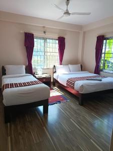 Postel nebo postele na pokoji v ubytování Hotel crystal fall