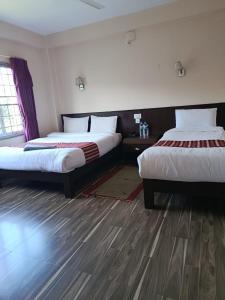 Postel nebo postele na pokoji v ubytování Hotel crystal fall