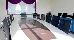 a conference room with a long table and chairs at Hotel Darulaman Alor Setar in Alor Setar
