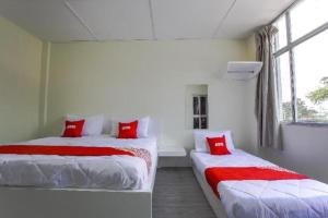 OYO 822 Zande Motel Kuala Selangorにあるベッド