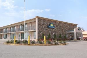 a building with a sign on the front of it at Days Inn by Wyndham Martin in Martin