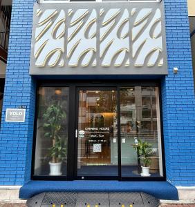 a store front with a sign on top of it at Yolo Hotel in Tokyo