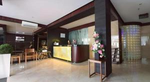 a lobby with a reception desk in a building at MP Hotel Kelapa Gading in Jakarta